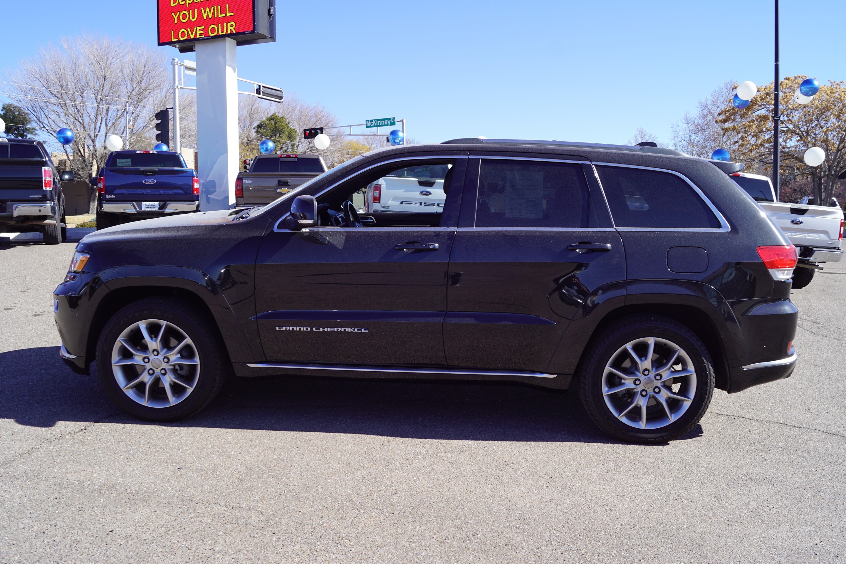 PreOwned 2015 Jeep Grand Cherokee Summit Sport Utility in